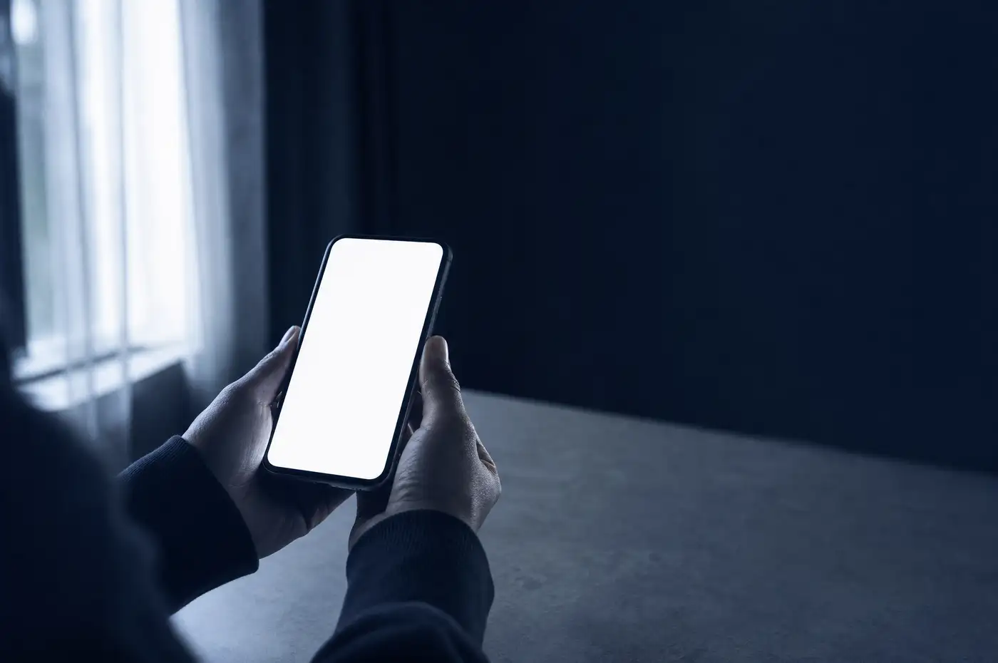 A person checking their claim eligibility on a phone